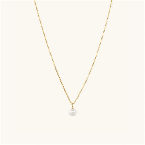 mejuri mini pearl pendant necklace.